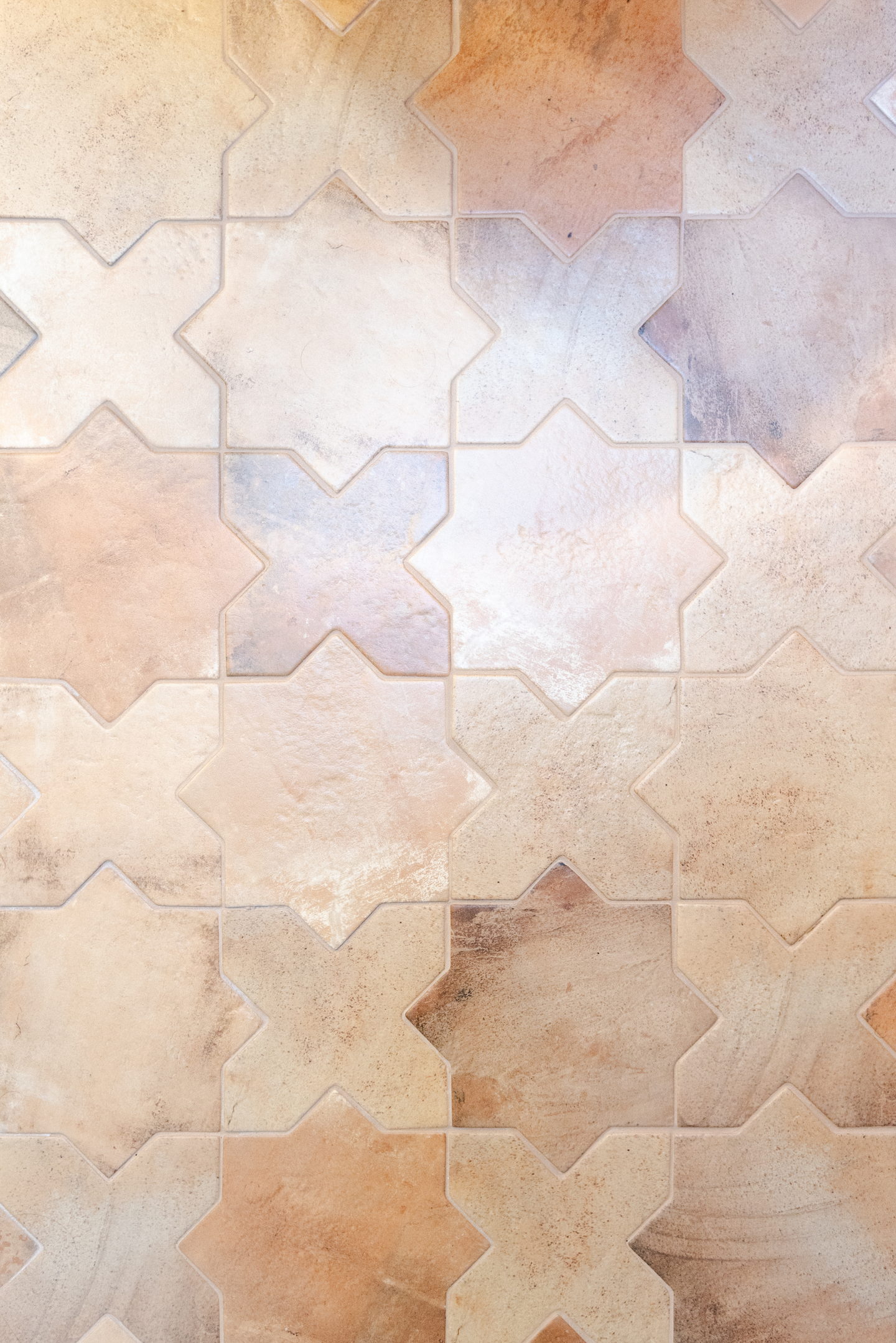 Close view of handmade terracotta tile showing its color variation