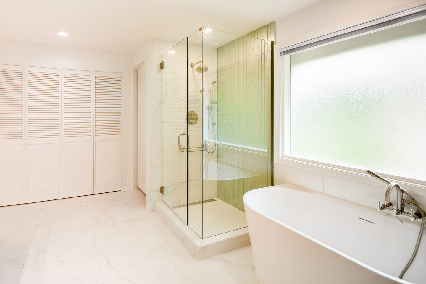 A Redmond bathroom with a freestanding tub and a glass shower