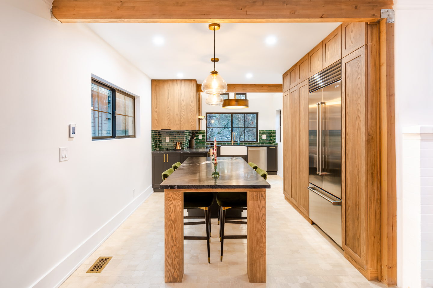 View from the hallway through an oak-framed opening into the finished kitchen