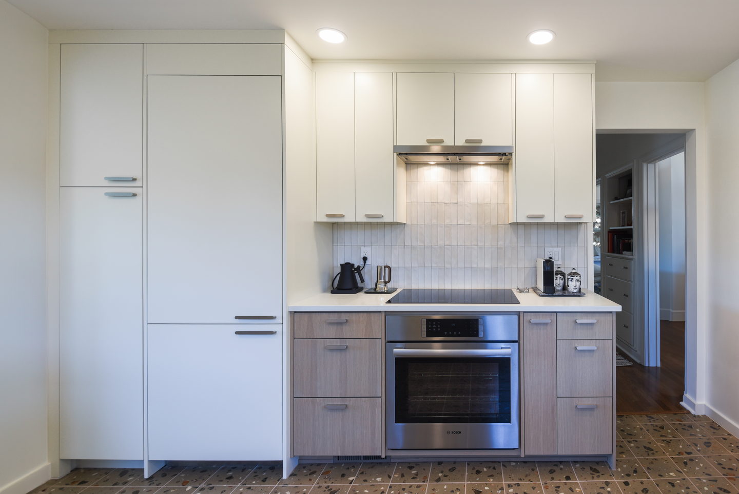 The tall run with the integrated fridge and the oven column