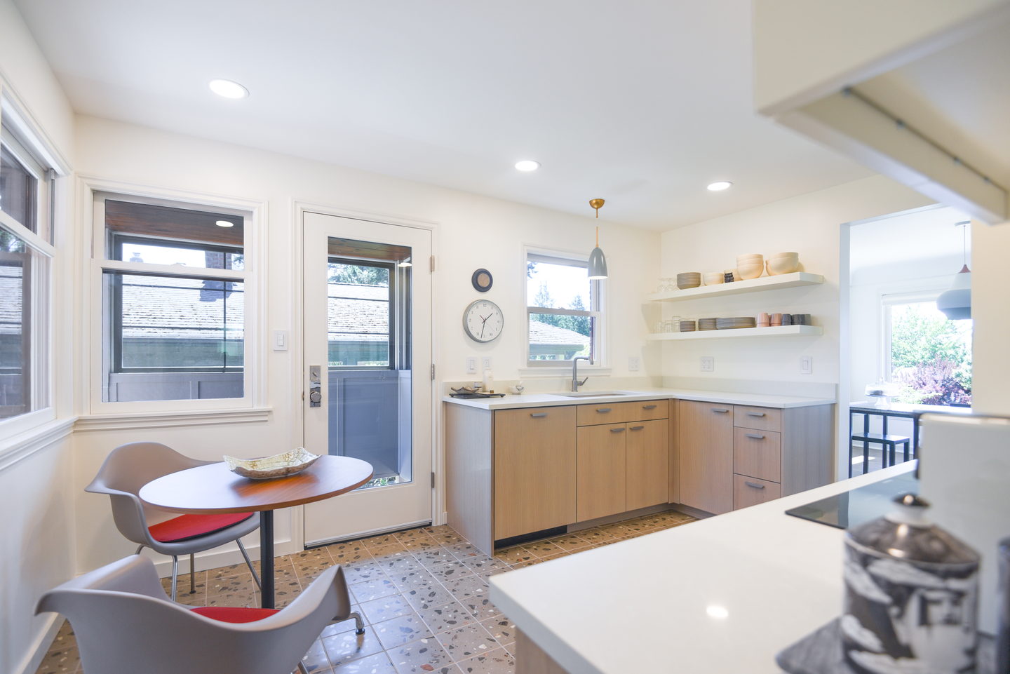 The kitchen looking through to the dining nook over the terrazzo floor